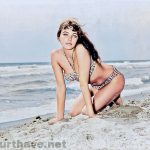 Joan Collins on the beach