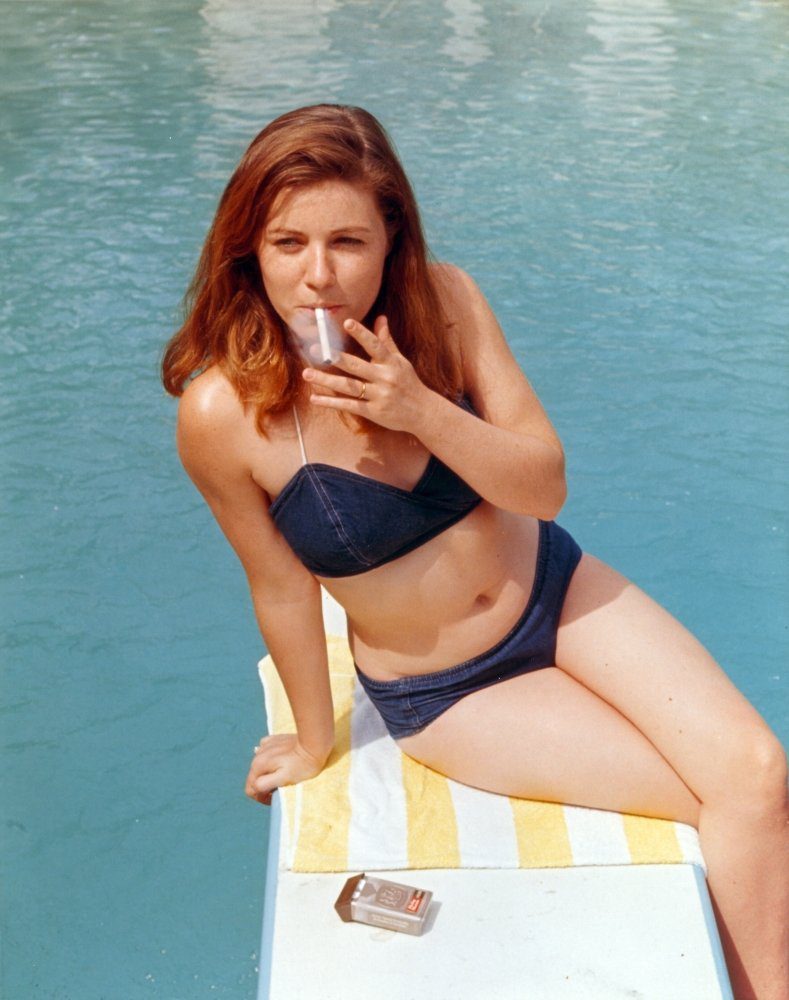 Patty Duke smoking at the pool