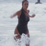 Lynda Carter running out of the water