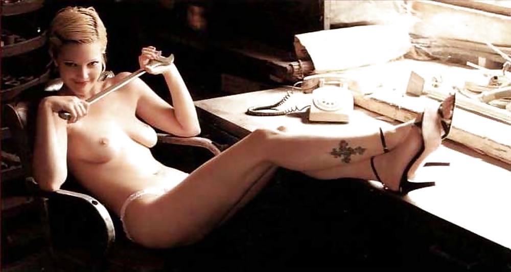 Drew Barrymore showing her tatoo’s